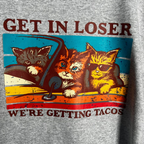 Close-up of TacoCats retro print with cats driving car to get tacos.