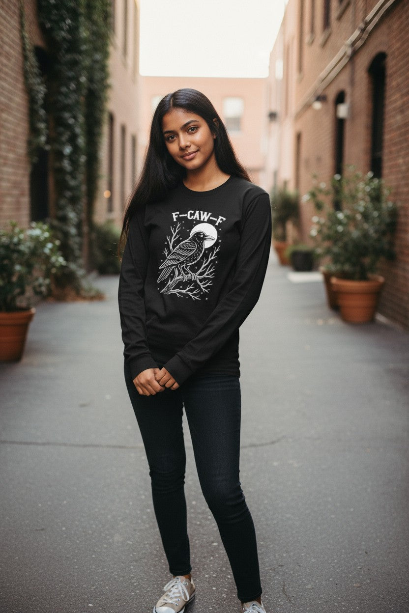 Woman wearing a black sweatshirt with a graphic design in an urban setting