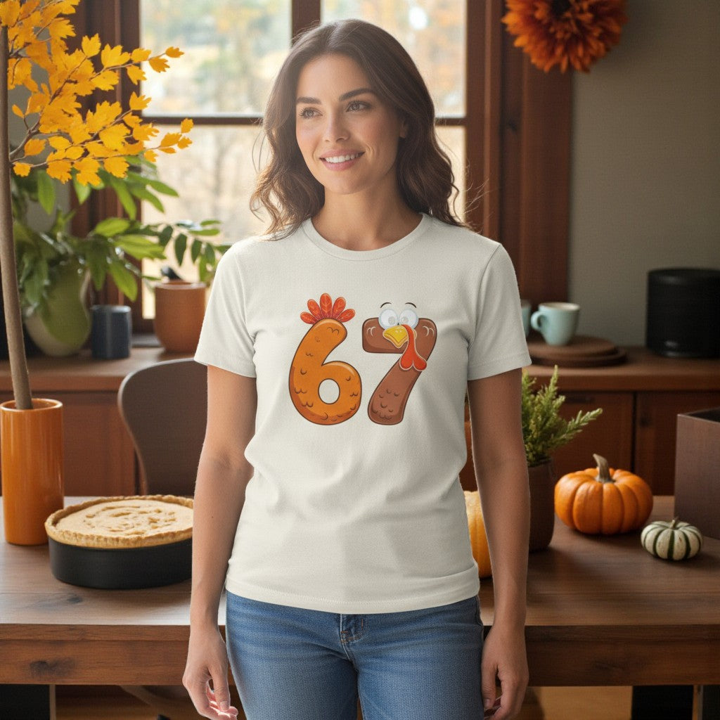 Woman wearing a t-shirt with a turkey design in a cozy room with autumn decorations.
