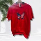 Actual product on stand. Red t-shirt with embroidered patriotic butterfly on front.