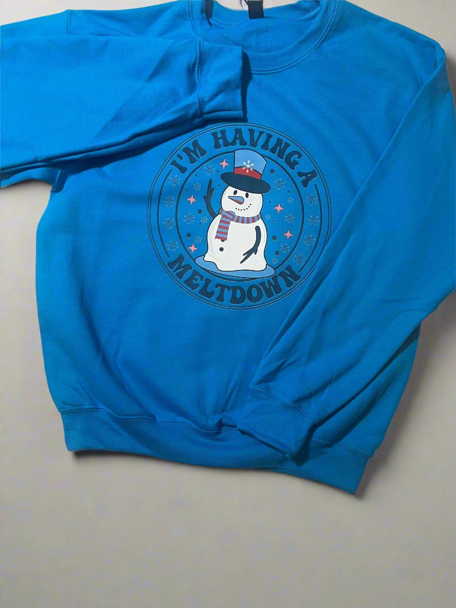 Warm winter graphic sweatshirt with funny melting snowman design