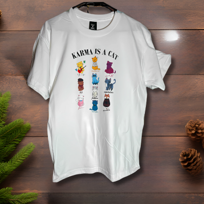 Woman wearing white Karma Is A Cat Taylor Swift lyric tee styled casually with jeans.