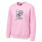 A light pink crewneck sweatshirt with a embroidered design on the front that reads 'Trust the LORD with all your heart' in black script, decorated with a pink and white heart and teal paint strokes.