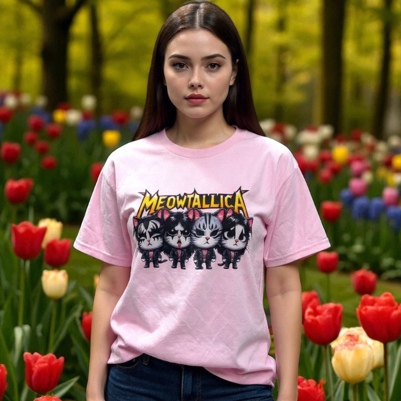 Woman model wearing pink Meow-tallica cotton shirt in a field of tulips.