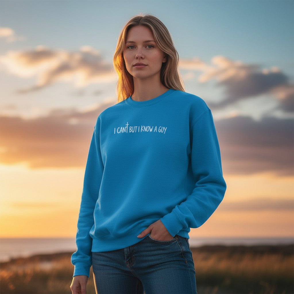 Woman wearing a blue sweatshirt with text at sunset