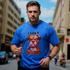Male model wearing a blue t-shirt with a dog graphic and text in an urban setting