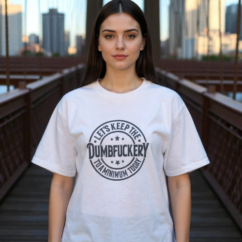 Woman model wearing a white t-shirt with text on it, standing on a bridge with a cityscape background