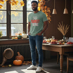 Man wearing a green t-shirt with 'talk TURKEY to ME' text in a festive room with pumpkins and autumn decorations.