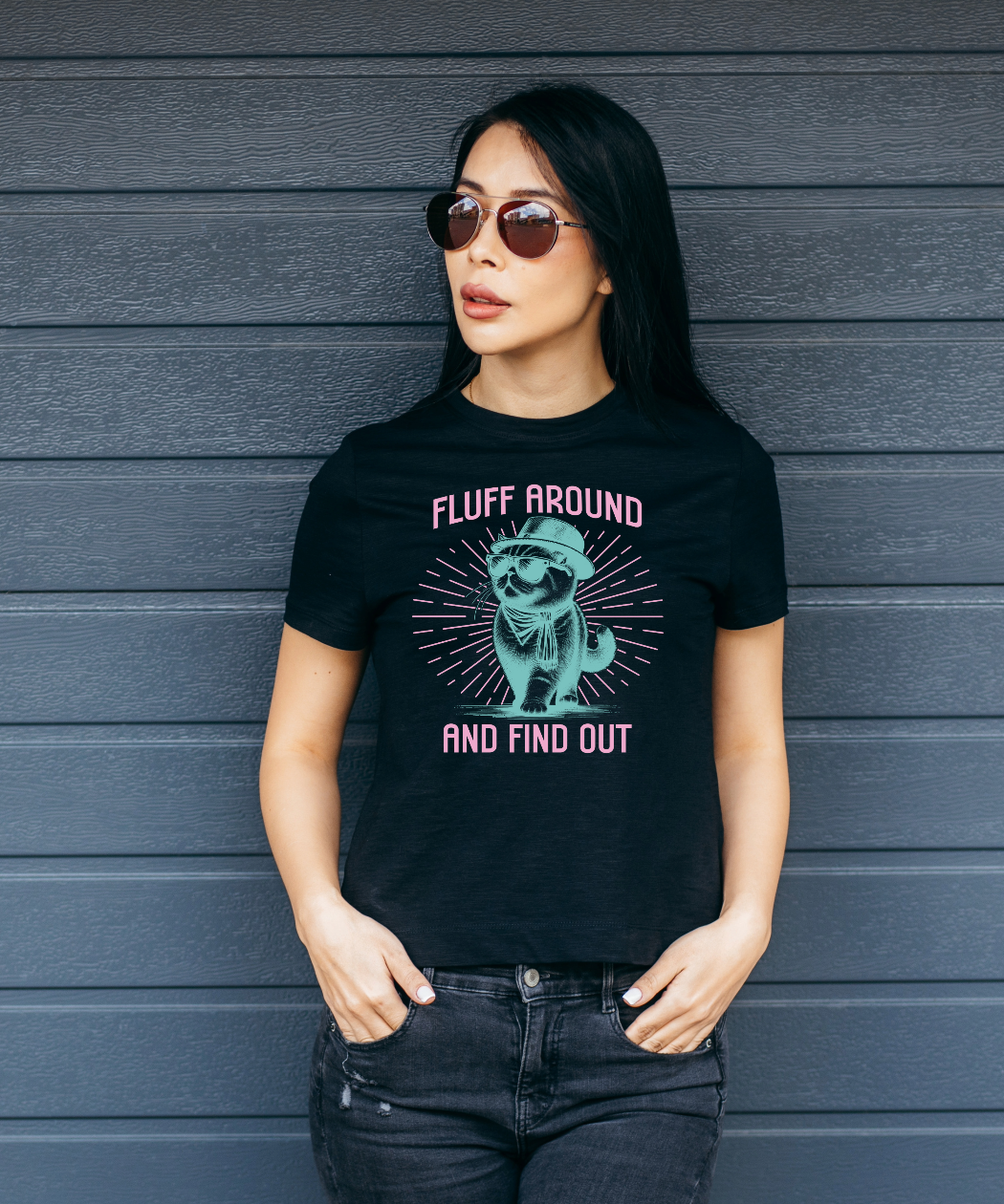 model wearing a black tee that says Fluff Around and Find Out