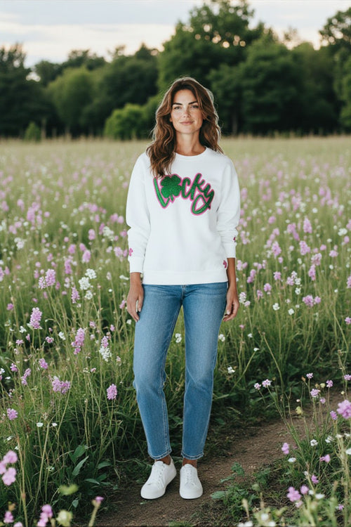 model wearing a white crewneck with glitter Lucky design.