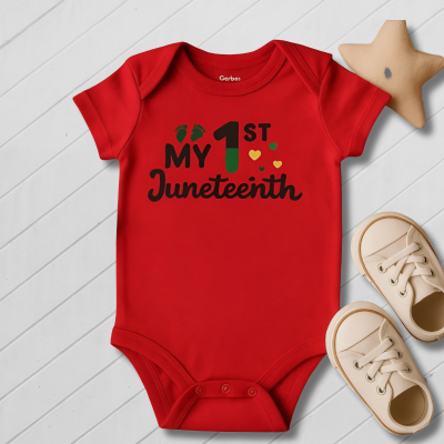 Red baby onesie with 'My 1st Juneteenth' text on a light wooden floor.