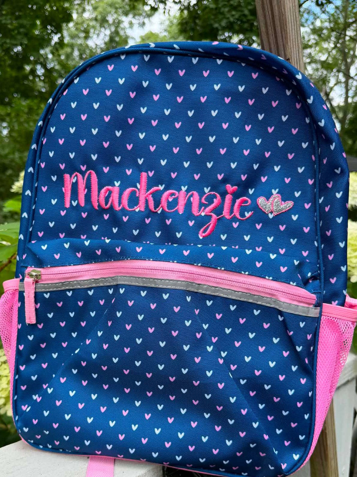 Personalized embroidered navy heart backpack with Mackenzie name