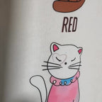Close-up of colorful cat illustrations representing Taylor Swift albums with lyric text Karma Is A Cat.