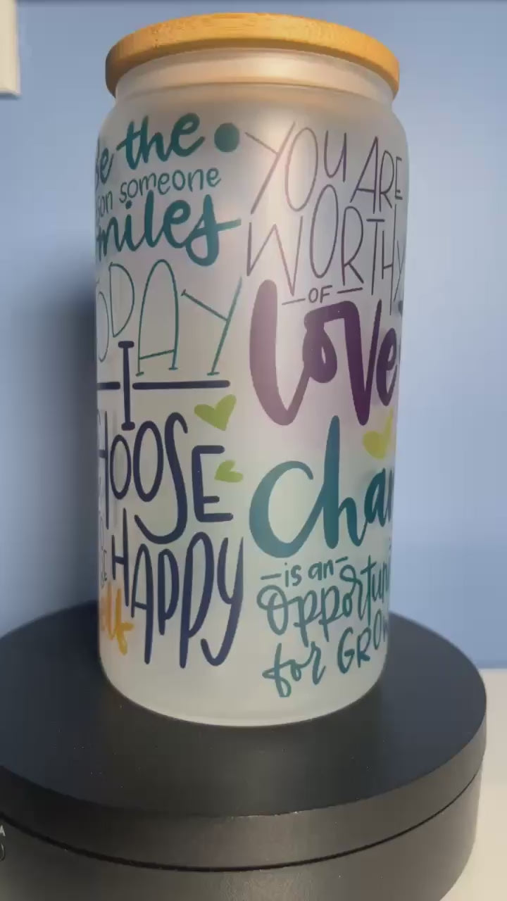 A video of  frosted glass motivational cup with colorful text