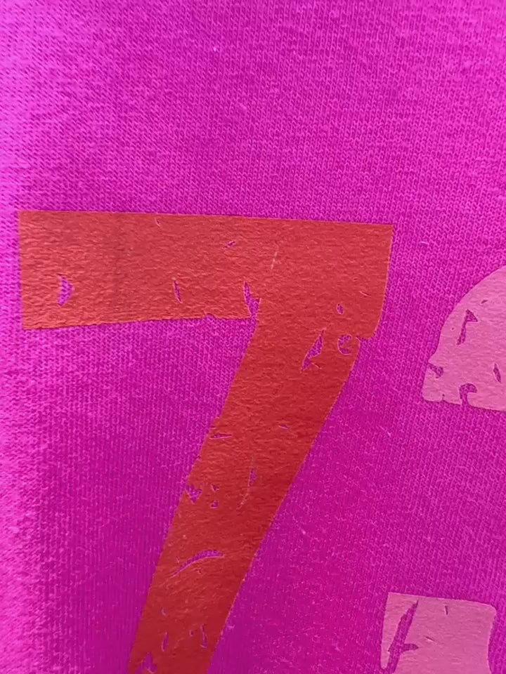 Video of Feminist empowerment shirt with 1973 close up of graphic.