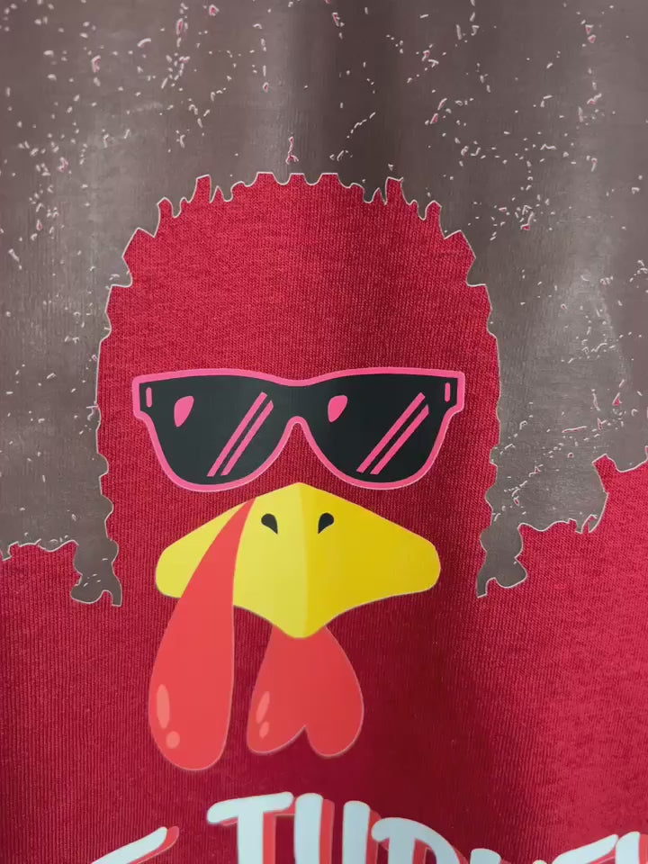Close up of focal point funky turkey shirt.