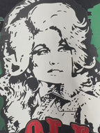 Holiday graphic tee featuring Dolly Parton portrait and Christmas charm