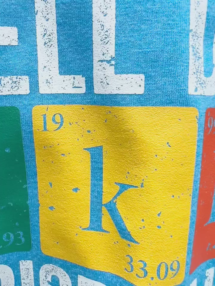 Video of actual product.  Blue Tshirt with the words "I Tell Dad Jokes Periodically But Only When I'm in my Element"