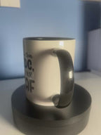 White Ceramic Mug with black writing