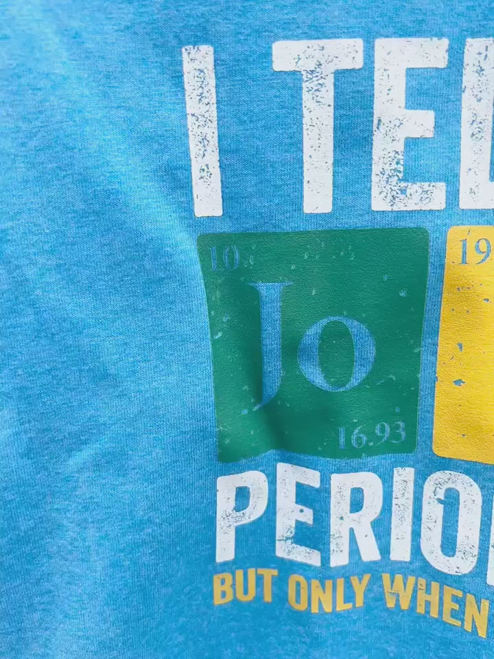 Video of blue “I Tell Dad Jokes Periodically” graphic tee focal point.