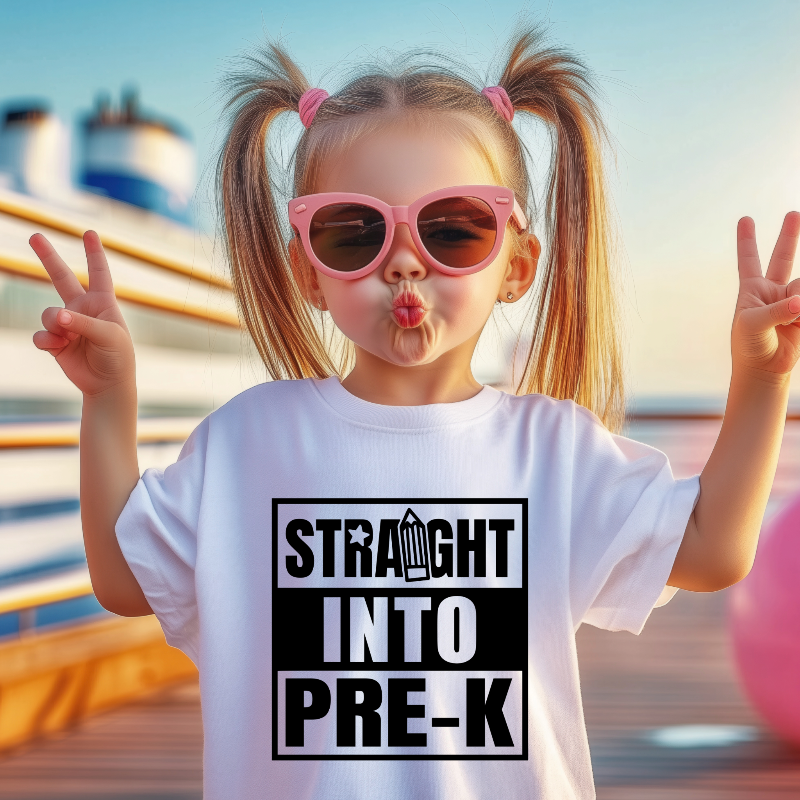 Child wearing a t-shirt with 'Straight into Pre-K' text, making peace signs on a blurred background.