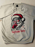 Cream crewneck holiday sweatshirt with retro Santa graphic and cheeky holiday message