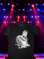 Black Elvis Presley graphic t-shirt with bold guitar design for fans displayed under concert lights.