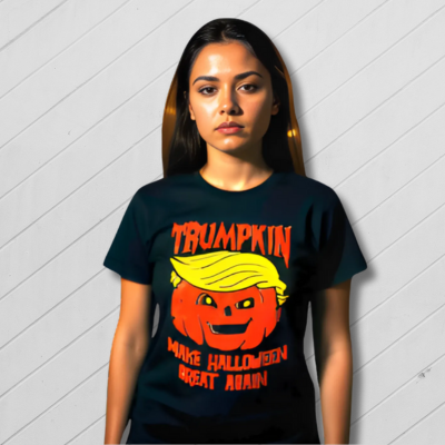 Black t-shirt with a pumpkin and text design on a white wooden background
