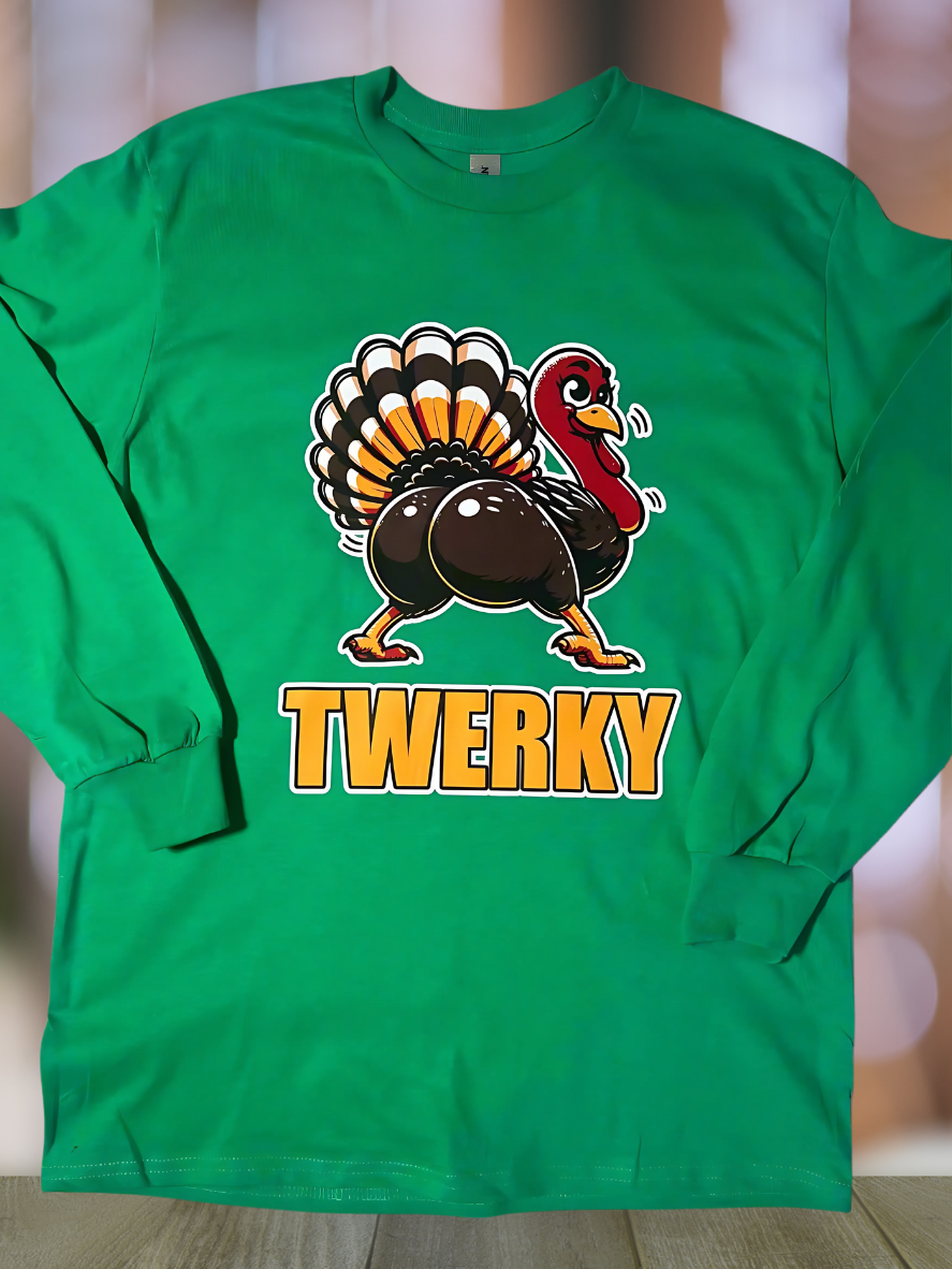 Close-up of turkey twerking graphic on green Ultra Cotton long sleeve Thanksgiving shirt.