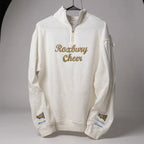 White sweatshirt with 'Roxbury Cheer' text and names with a megaphone on the sleeves on a gray background