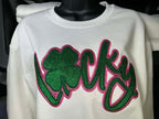 White sweatshirt with green and pink 'Lucky' design on a mannequin.