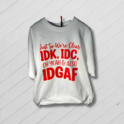 White t-shirt with red text on a red and white radial background