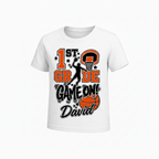 A white short-sleeve kids' t-shirt with a custom '1st Grade Game On David' basketball graphic on the front, displayed against a clean white background.