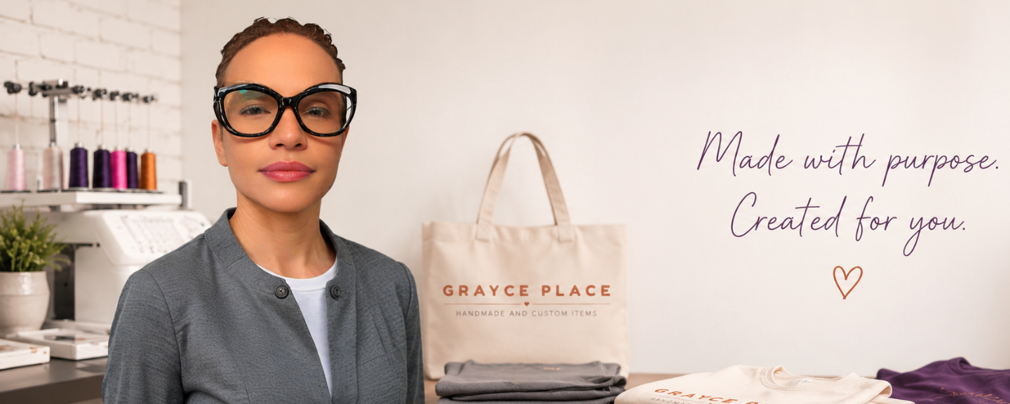 A cream tote bag with 'GRAYCE PLACE' printed on it, folded garments, and a purple fabric item. The background features a white wall with the text 'Made with purpose.